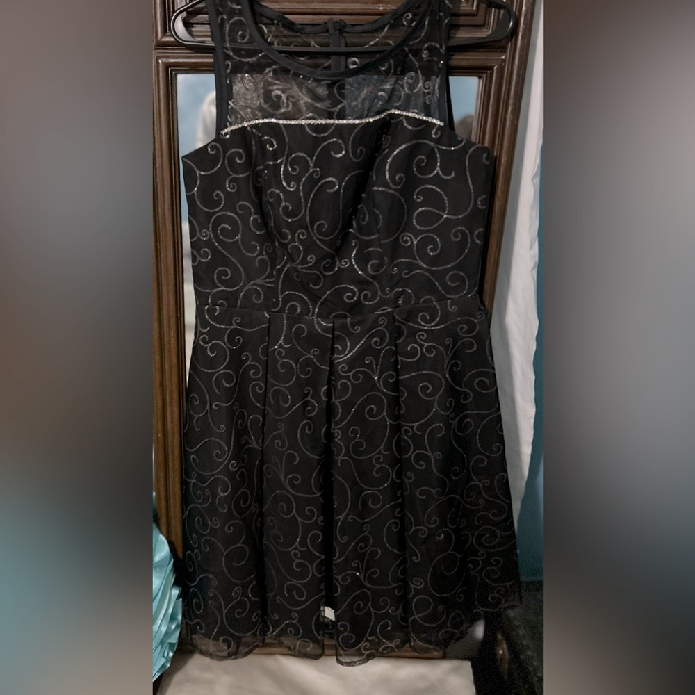Black dress with silver swirls made by southeastern! No tears rips or flaws